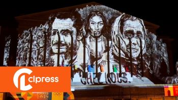 Aya Nakamura's portrait projected onto the National Assembly by the "Banlieues Climat" collective.