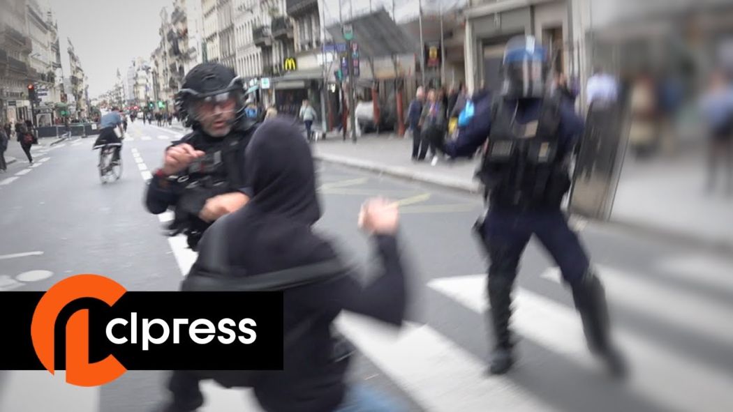 A police commissioner chased by protesters