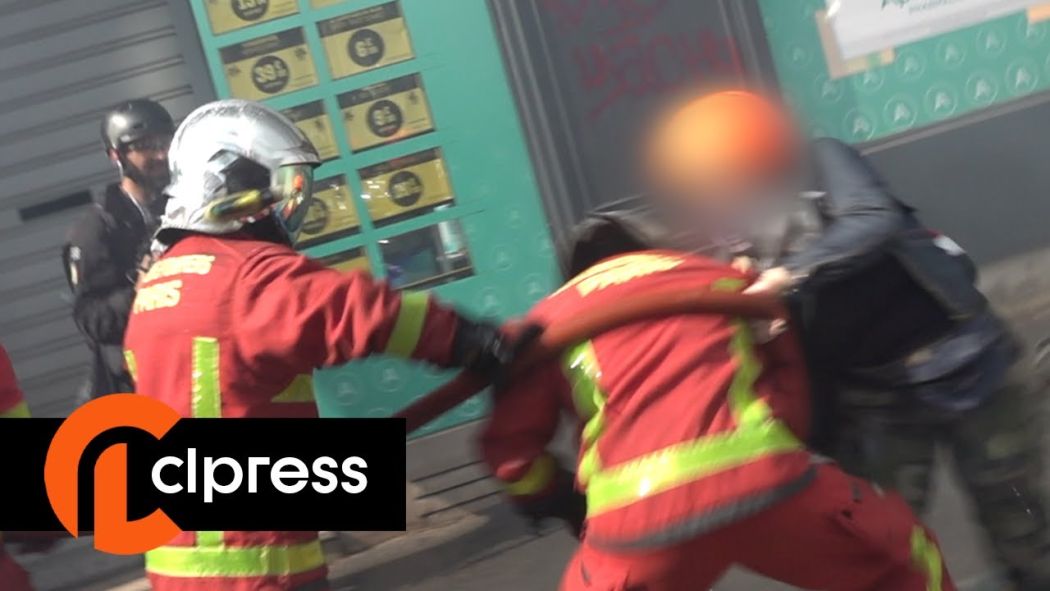 A firefighter attacked by demonstrators at the May 1, 2022 demonstration.