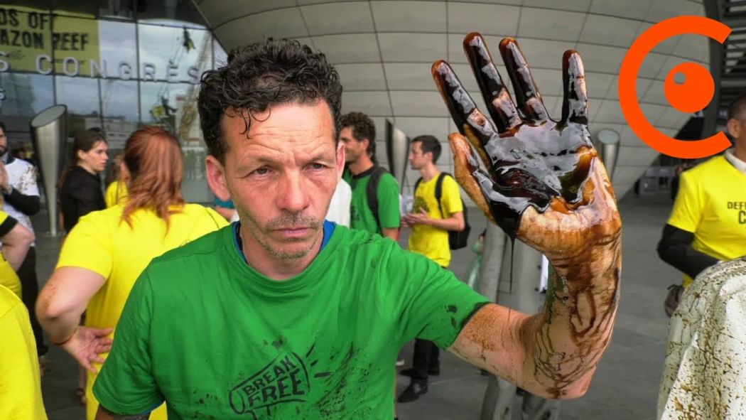 Greenpeace disrupts Total shareholders' meeting
