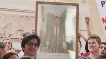 Removal of Macron's portrait by activists